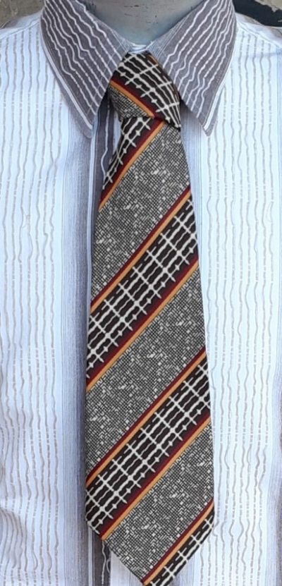 1970's Super Wide tie, tweed abstract print, autumnal colours, polyester by 'Flying High'
